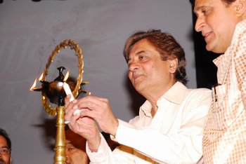 1 Chairman Mr Devendra Khandelwal lighting the lamp being watched by Nathusingh Gurjur